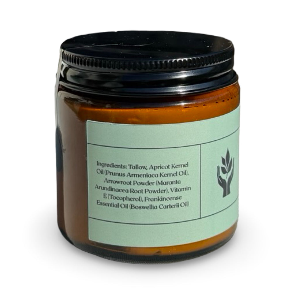 Close-up of Present Body Co. Frankincense grass fed tallow balm jar.