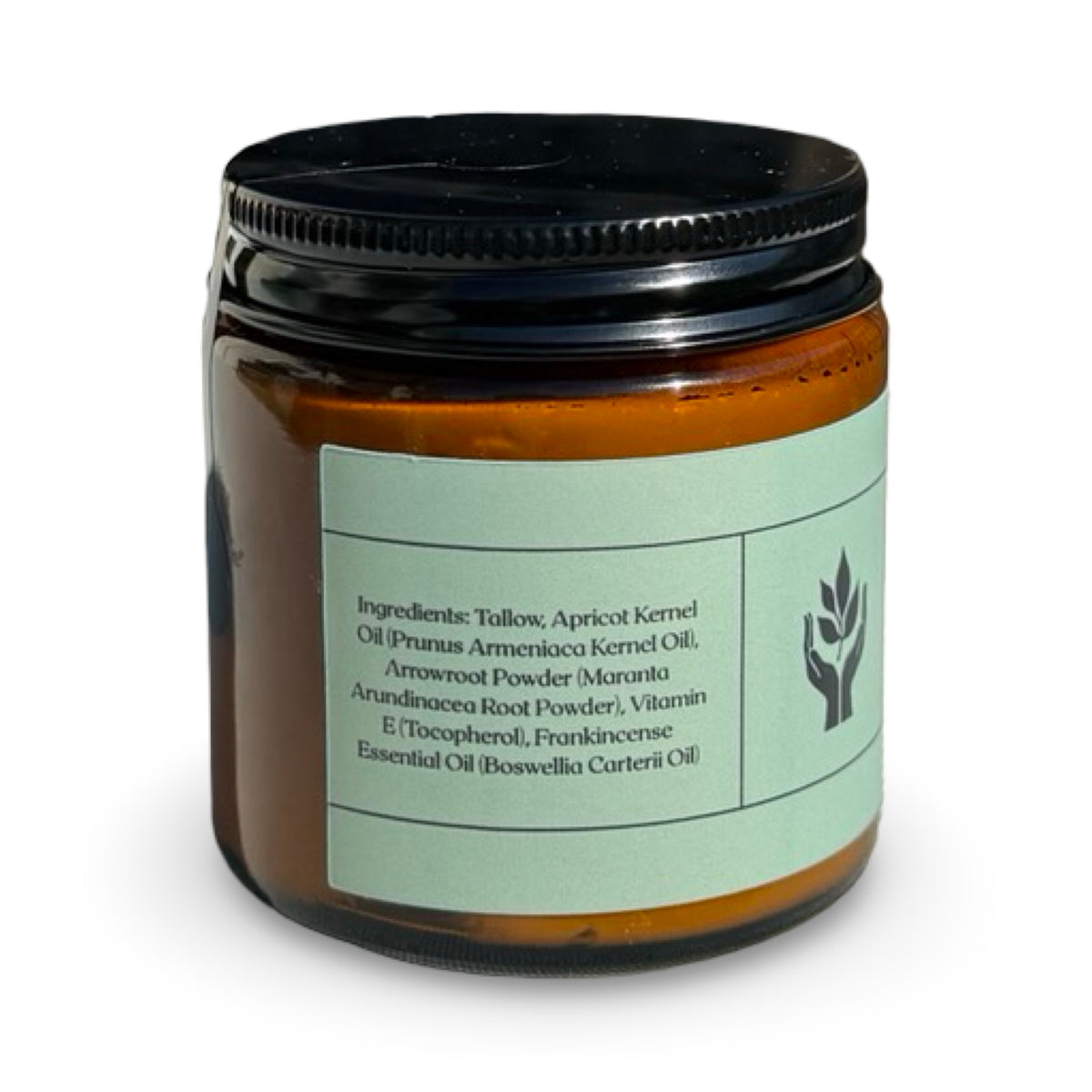 Close-up of Present Body Co. Frankincense grass fed tallow balm jar.