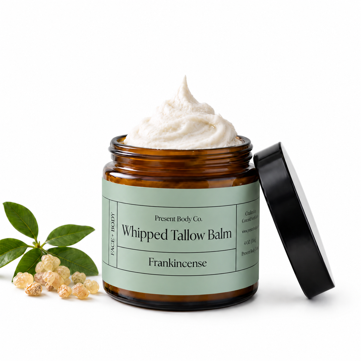 Present Body Co. Frankincense Whipped Tallow Balm in a 4 oz amber glass jar.
