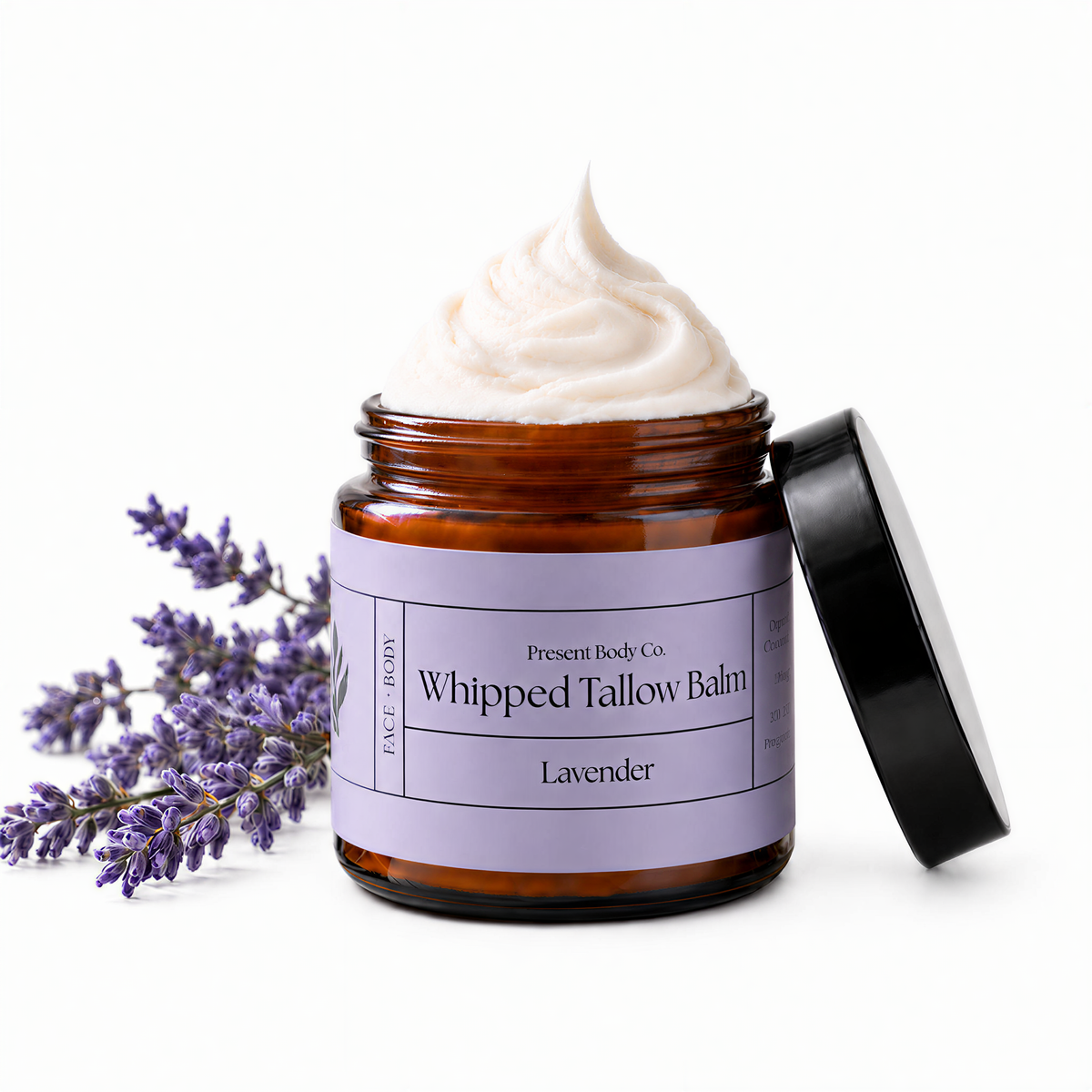 Present Body Co. Lavender Whipped Tallow Balm in a 4 oz amber glass jar.