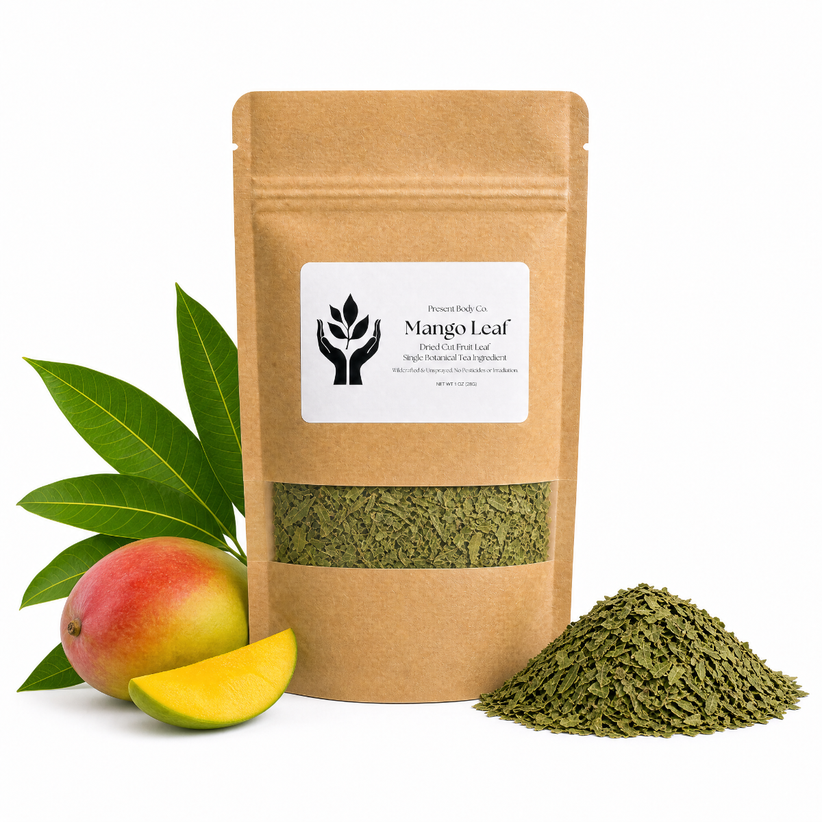 A kraft paper stand-up pouch of Mango Leaf by Present Body Co., shown on a white background with a whole mango, a mango slice, green leaves, and a pile of dried green leaf material.