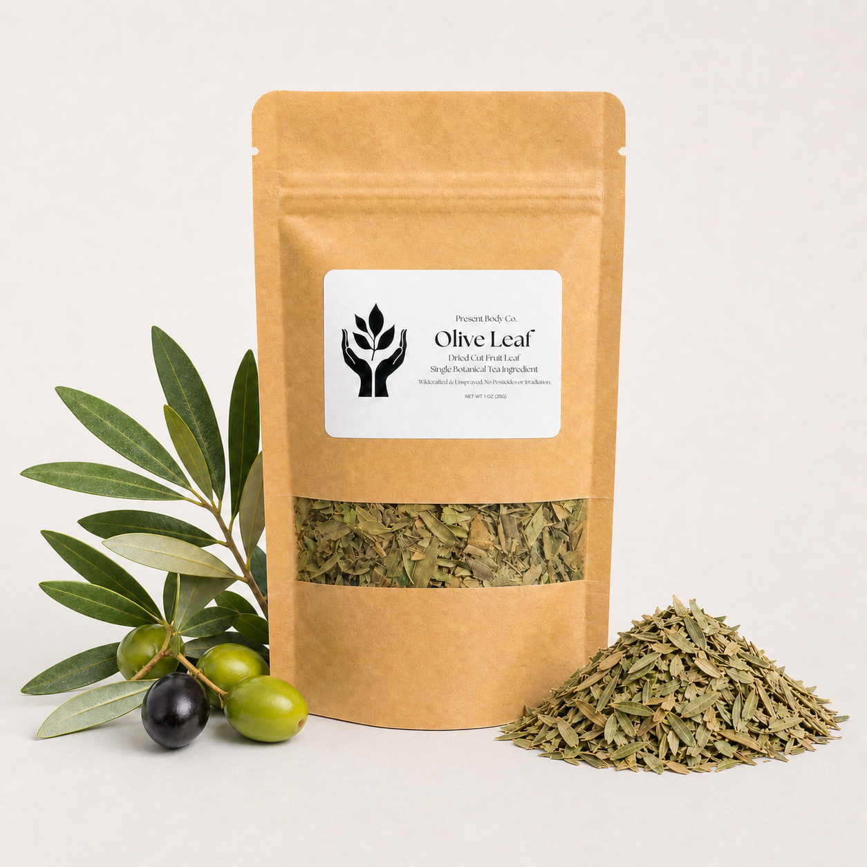 A kraft paper stand-up pouch labeled 'Olive Leaf' with a clear window showing dried olive leaves inside, styled with green and black olives and a small pile of loose dried leaves on a light neutral background.