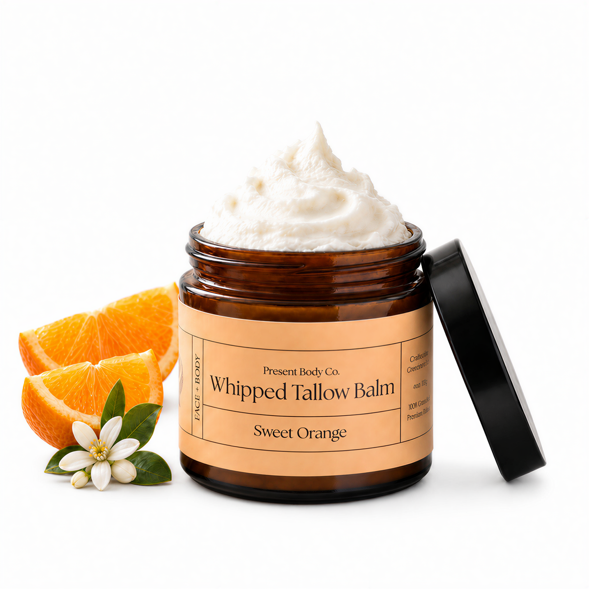Present Body Co. Sweet Orange Whipped Tallow Balm in a 4 oz amber glass jar.