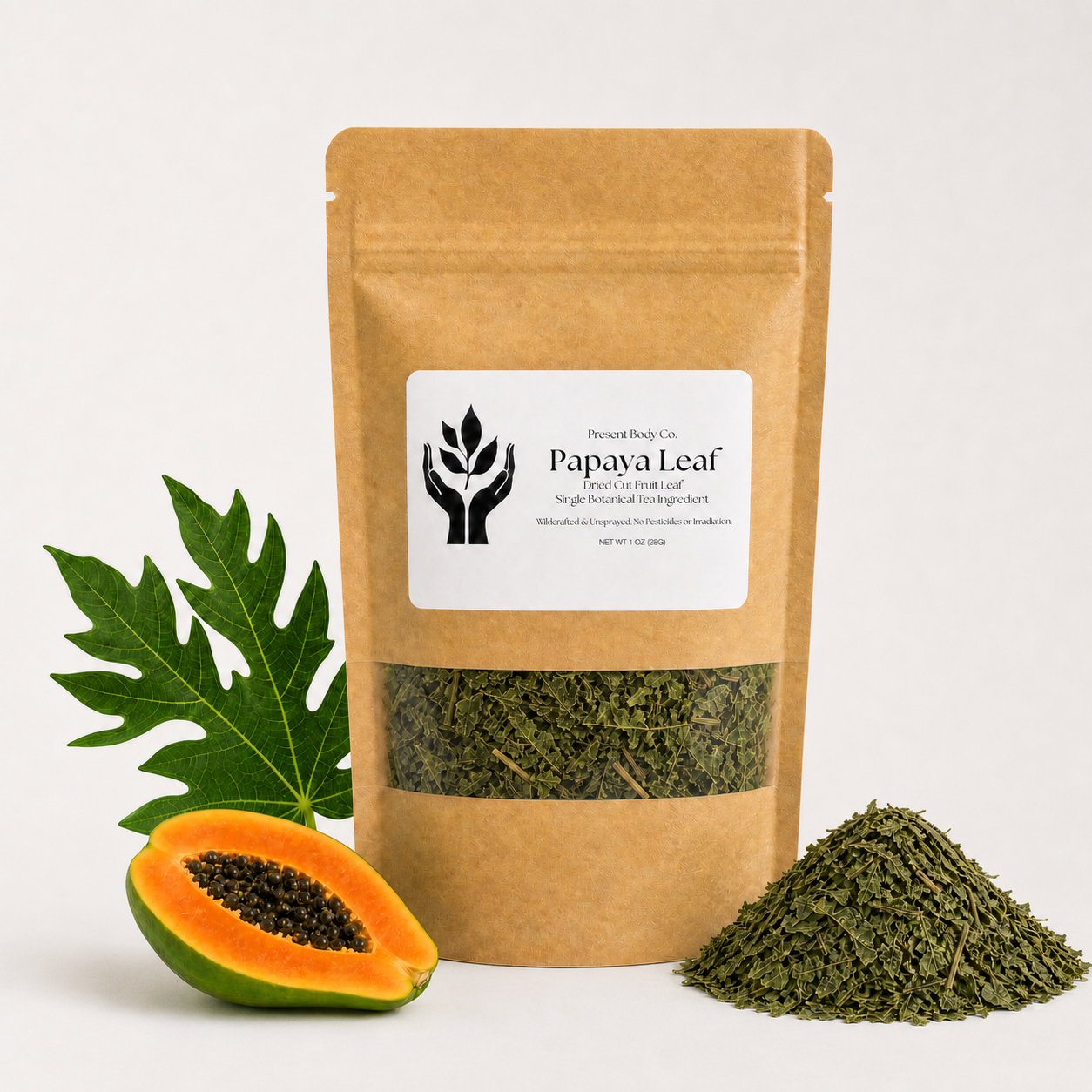 A kraft paper stand-up pouch labeled 'Papaya Leaf' with a clear window showing dried green leaves inside, styled with a whole papaya, a sliced papaya half, and a pile of the dried leaves on a clean white background.