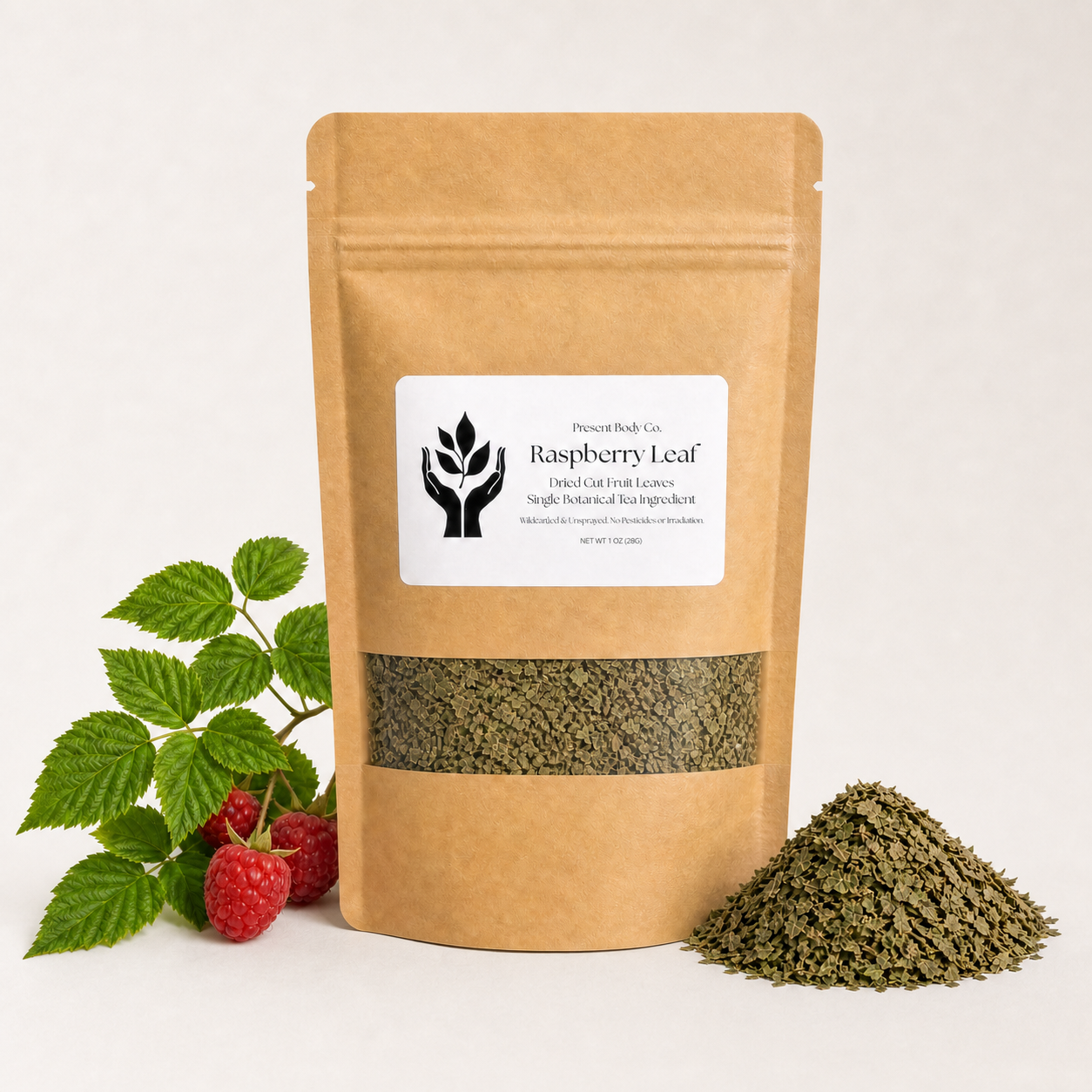 A kraft paper stand-up pouch labeled Raspberry Leaf by Harvest Rich Co., shown on a light neutral background with green raspberry leaves and berries on the left and a small pile of dried green leaf powder on the right.