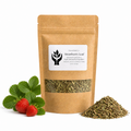 A kraft paper stand-up pouch labeled 'Strawberry Leaf' with a clear window showing dried green leaves inside, styled with fresh green strawberry leaves and two strawberries on the left and a small pile of the dried leaves on the right, on a white background.